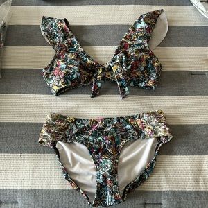 New in bag! Venus 2 piece bikini. Top is a Large and bottoms are a size 10